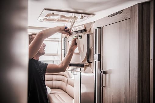 RV technician working on repairs - Licensed from iStock