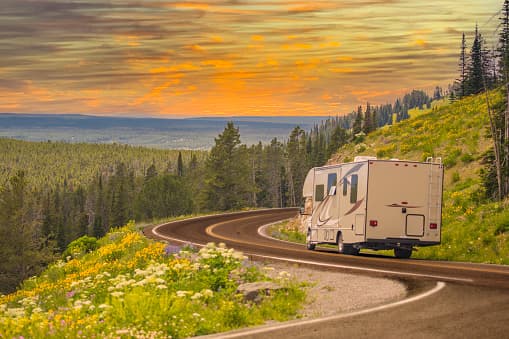 RV traveling on scenic mountain highway - Licensed from iStock